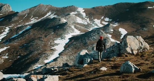 Traveler Male Puts Hike Backpack and Start His Way on Mountain Trip Adventure