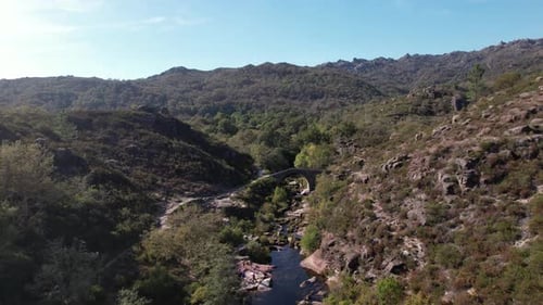 Flying Over Ancient Stone Bridge Over Beautiful River. Amazing Nature Landscape