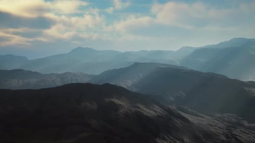 Breathtaking Aerial View of Majestic Mountain Peaks Stretching