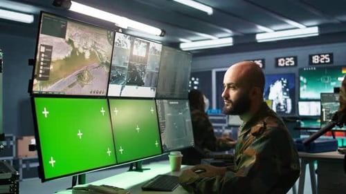 Army Specialist Engaging Enemy Forces Using Mockup Monitors