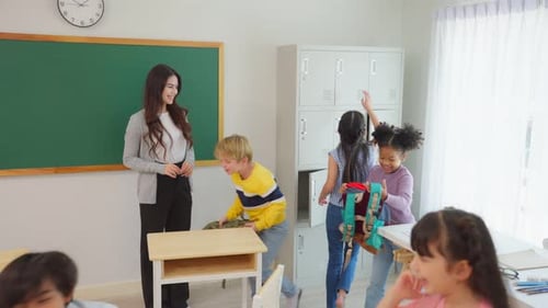 Young student leave classroom after finished study in elementary school.