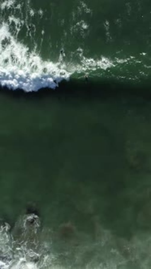 Vertical Video of Ocean Waves Rolling On Shoreline