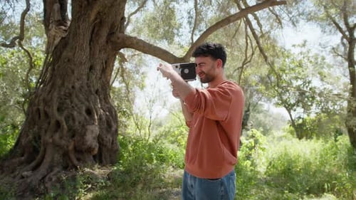 Young Man Shoots With Vintage Super 35 Camera In The Calabrian Countryside