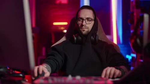 Young Adult Man Using Computer at Night