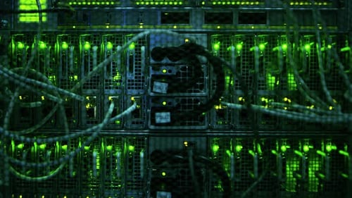 Close-up Shot In Data Center: Insides of the Working Server Rack Showing Hardware Equipment, Fiber