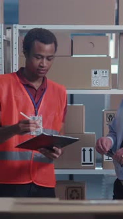 Diverse Colleagues Men Director and Executive in Uniform Cooperating in Warehouse Storage Stillage