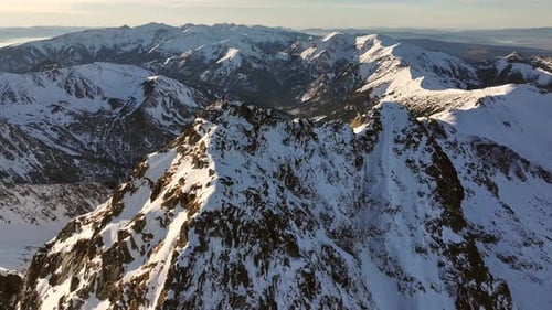 Aerial view of the stunning snow-covered Alps mountains in winter