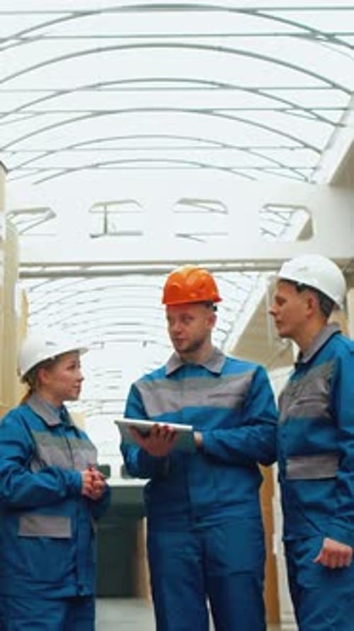 Engineers Workers at Cardboard Box Factory Discuss Supply of Paper for Continuous Production of