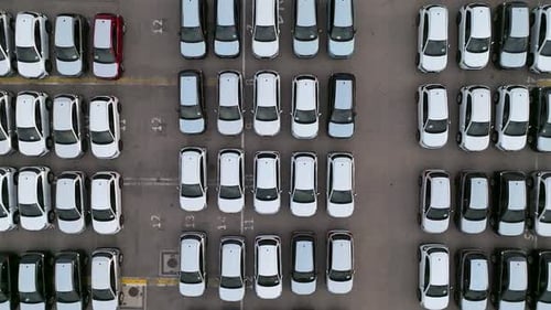 New cars parked in rows ready for delivery, Top down view