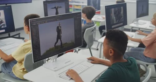 Primary School Students Working on Computers Creating 3D Objects Studying Game Development