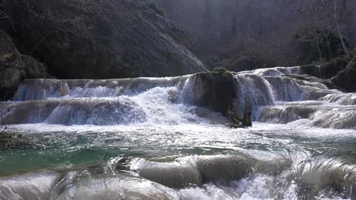 Flowing Waterfall Cascading Over Rocks