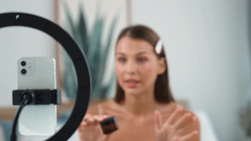 Woman Presents Makeup Tutorial for Online Video Blog