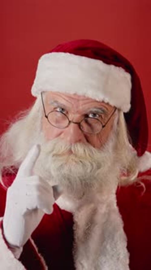 Frowning Santa Wagging Finger, on Red Background