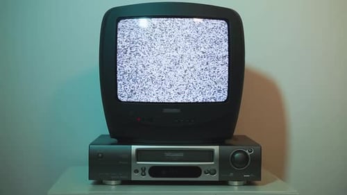 Black Television and VCR with VHS Tape