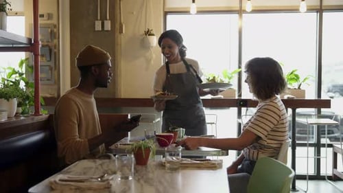 Waitress Serving Brunch to Young Couple at Cafe Table 2024 Years