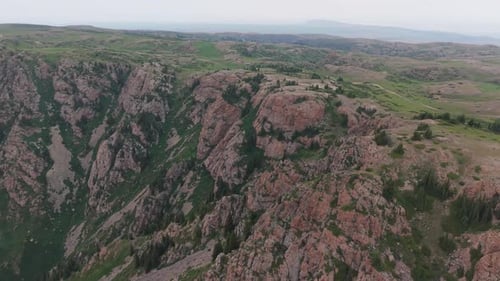 Rocky Mountain Landscape Showing Green Valley and Cloudy Sky