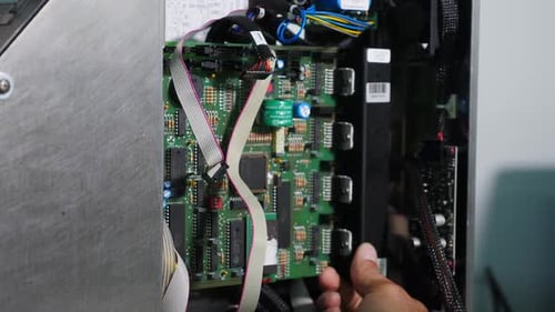 Unrecognizable Man Assemblying Electrical Part of Device Electronic Equipment Repair Shop Engineer