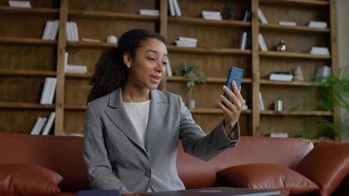 Businesswoman Video Calling in Modern Office