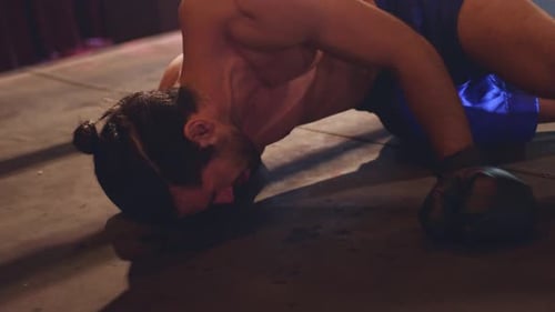 Boxer Gets Knocked Down in the Ring