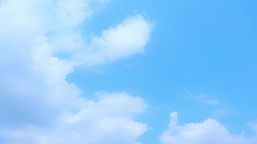 Clouds Drifting Across a Blue Sky