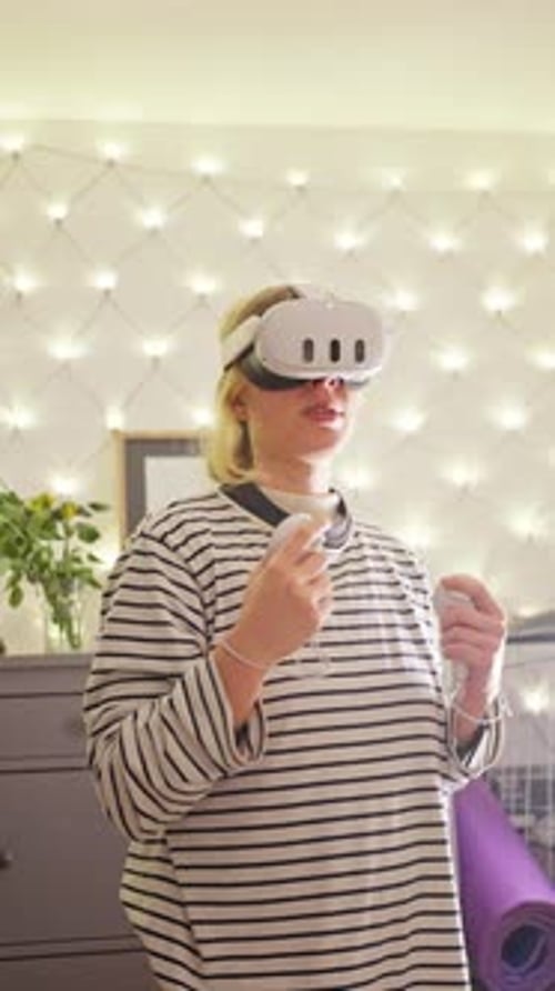 Young Woman Using Virtual Reality Headset at Home