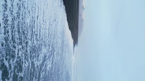 Vertical Video Aerial View of Arctic Black Sand Beach