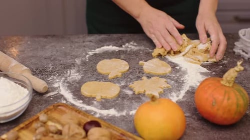Woman Making Fall Cookies in Home Kitchen