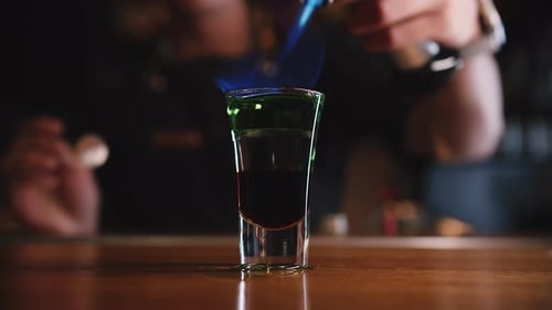 Flaming Shot Glass Cocktail at Nightclub Bar
