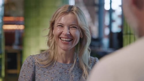 Happy Smiling Couple Sitting Indoors in Restaurant Talking Have Dinner Man and Woman Have Relax Time