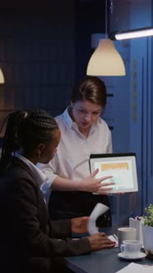 Vertical Video Workaholics Diverse Multiethnic Businesspeople Analyzing Financial Graphs Using