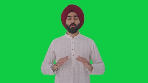 Sikh Indian man doing Yoga Green screen