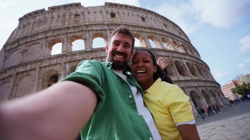 Happy Couple Takes Selfie at the Colosseum in Rome