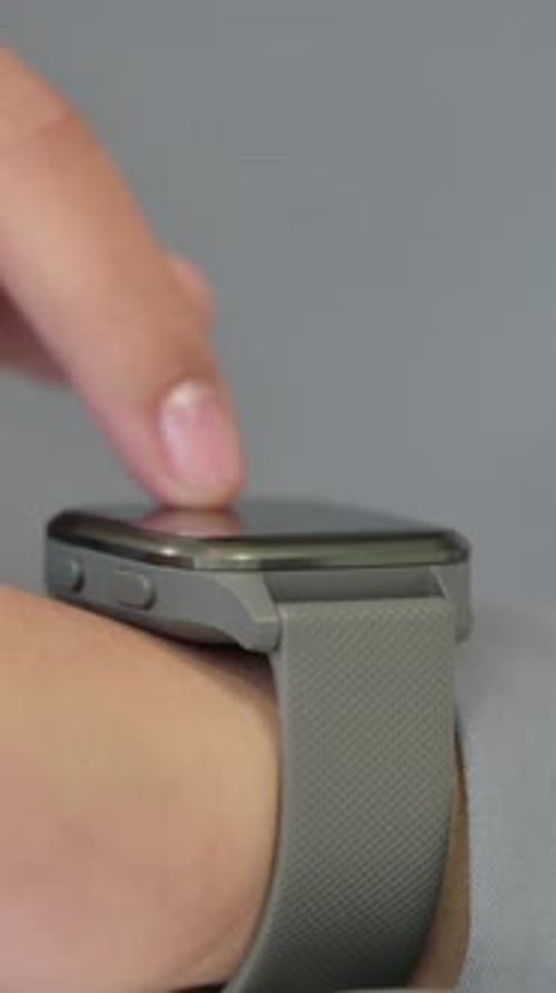 Hands Vertical Close up of African Woman using Smart Watch