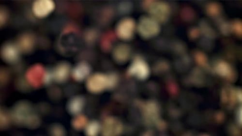 Scattering of Red, Black, and White Peppercorns