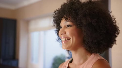 Smiling Woman with Curly Hair Indoor Portrait