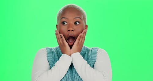 Black woman, face and wow with green screen in studio for gossip or news