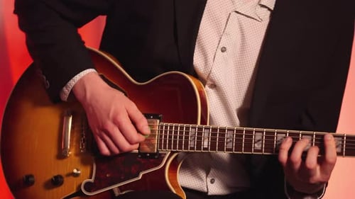 A Classic Musician Playing Electric Guitar. Close-up Shot