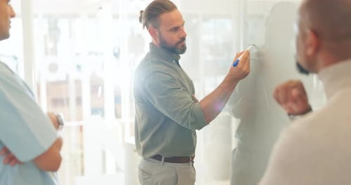 Men Collaborating on Project in Modern Office