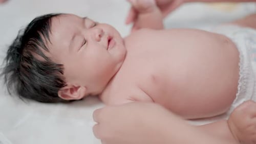 Gentle Touch: Baby Getting Caressed by Parent