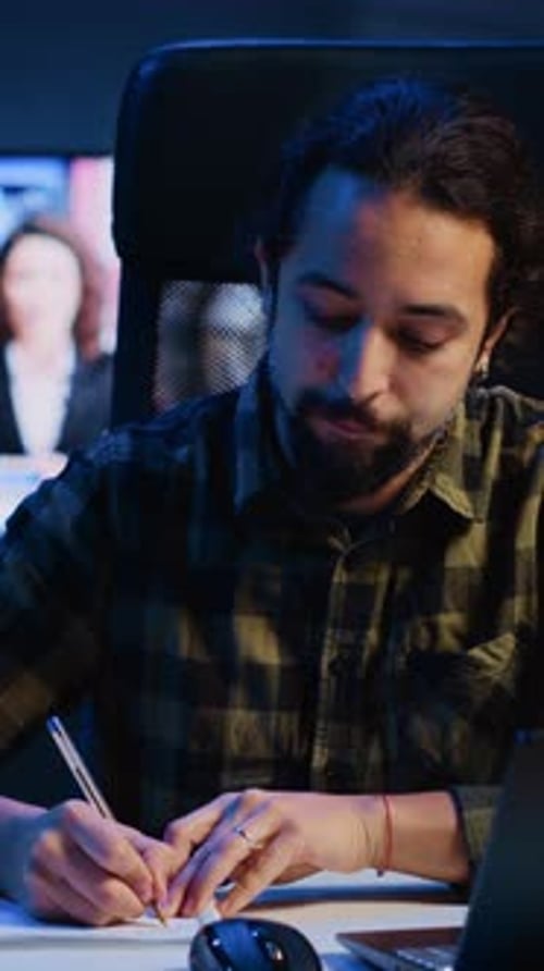 Vertical Video Freelancer Noting Down Ideas on Paper Using Pen While Teleworking