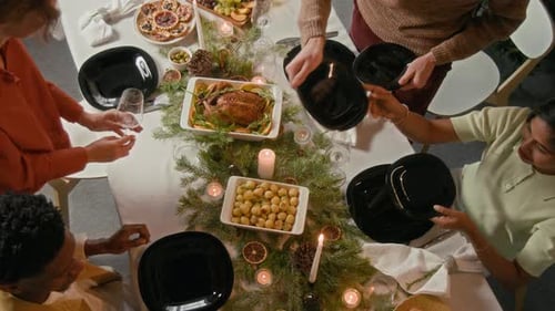Friends Setting Table for Festive Meal Celebration