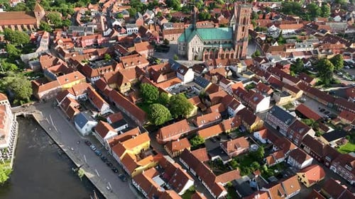 Shot of historic Ribe with its red-roofed buildings, half-timbered houses, Ribe Cathedral Square and
