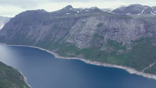 Beautiful nature Norway natural landscape Lovatnet lake flies above the clouds. fjords and mountains