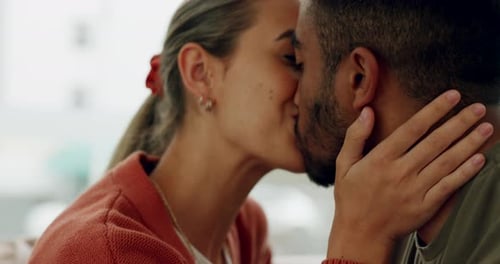 Loving Couple Kissing and Embracing Intimately Indoors