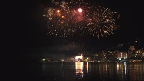 Fireworks with Colorful Lights Over Sea