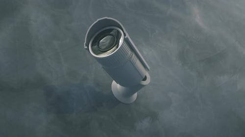 CCTV camera installed on wall of the building. Scan the area for surveillance purposes