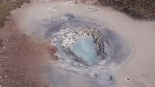 Steam rising from mudpot outside Iceland Deep Drilling Project, aerial
