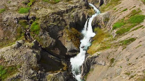 Waterfall in the Mountains Clear Glacial River Flows in the Canyon Iceland Summer Nature Clear Sunny