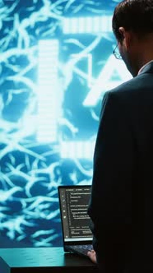 Professional Working on AI Software in Futuristic Office