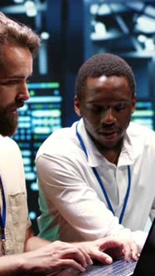 Vertical Video Colleagues Running Data Center Tests